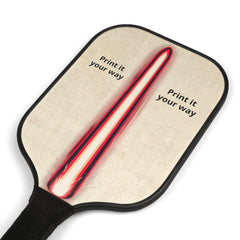 A close-up of a wooden pickleball paddle shows the red, white, and black striped design on the paddle face, with "Print it your way" text on both sides.